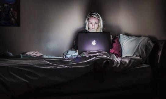 how it's going; on computer in dark bedroom